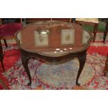 A mahogany shaped coffee table cabriole