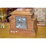 An architectural light oak mantle clock,