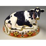 A Royal Crown Derby paperweight Friesian