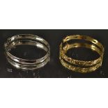 An ornate cast rolled gold hinge bangle,