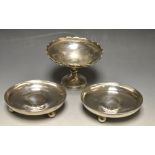 A pair of Edwardian silver circular bon