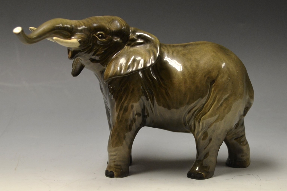 A Beswick model of an Elephant, lifted h