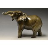 A Beswick model of an Elephant, lifted h