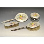 An enamel dressing table set, comprising