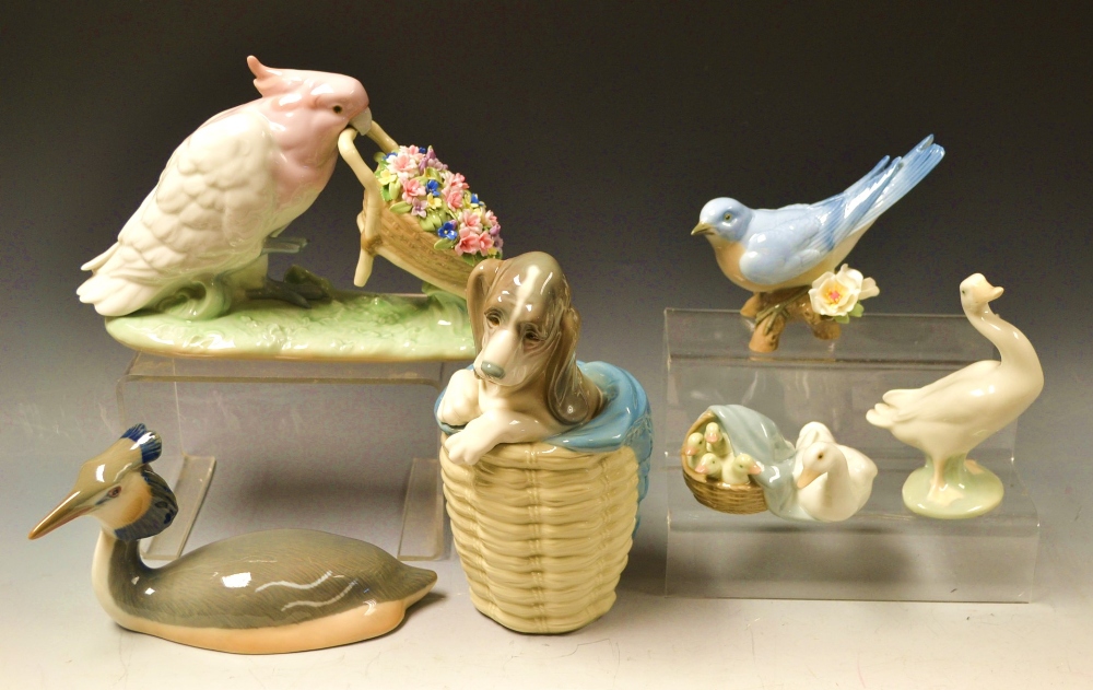 A Lladro figure, Polly Pushing Posies, b