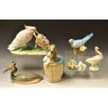 A Lladro figure, Polly Pushing Posies, b