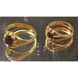 Two 9ct gold and garnet rings (4.9g)