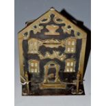 A Victorian novelty iron money box as a