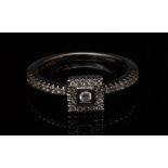 A  pave diamond ring, central raised rou