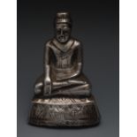 A Burmese white metal figure of a seated