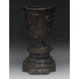 A 19th century bronze urn, in relief wit