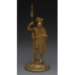 A 19th century gilt bronze mantel figure, cast as a Native American, he stands, holding a spear,