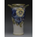 A Moorcroft Pansy pattern two-handled sl