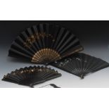 A Victorian ebony and fabric fan, the bl