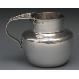 An Arts and Crafts silver ovoid milk jug