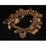 A 9ct gold hollow link curb charm bracel