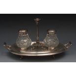 A Victorian oval inkstand, the central t