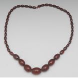 A single strand cherry amber bead neckla