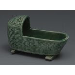 A Staffordshire green glazed cradle, the