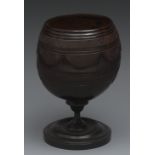 A 19th century coconut cup, carved with