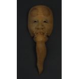 A Japanese ivory netsuke, carved as an O