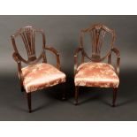 A pair of Hepplewhite design mahogany children's elbow chairs, shield backs carved with ears of