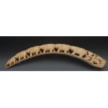 An early 20th century carved ivory tusk,