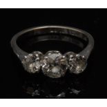 A three stone diamond ring, central roun