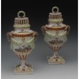 A pair of Dresden pedestal vases and cov