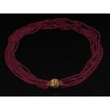 A six strand rough cut ruby bead necklac