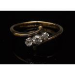 A three stone diamond ring, three gradua