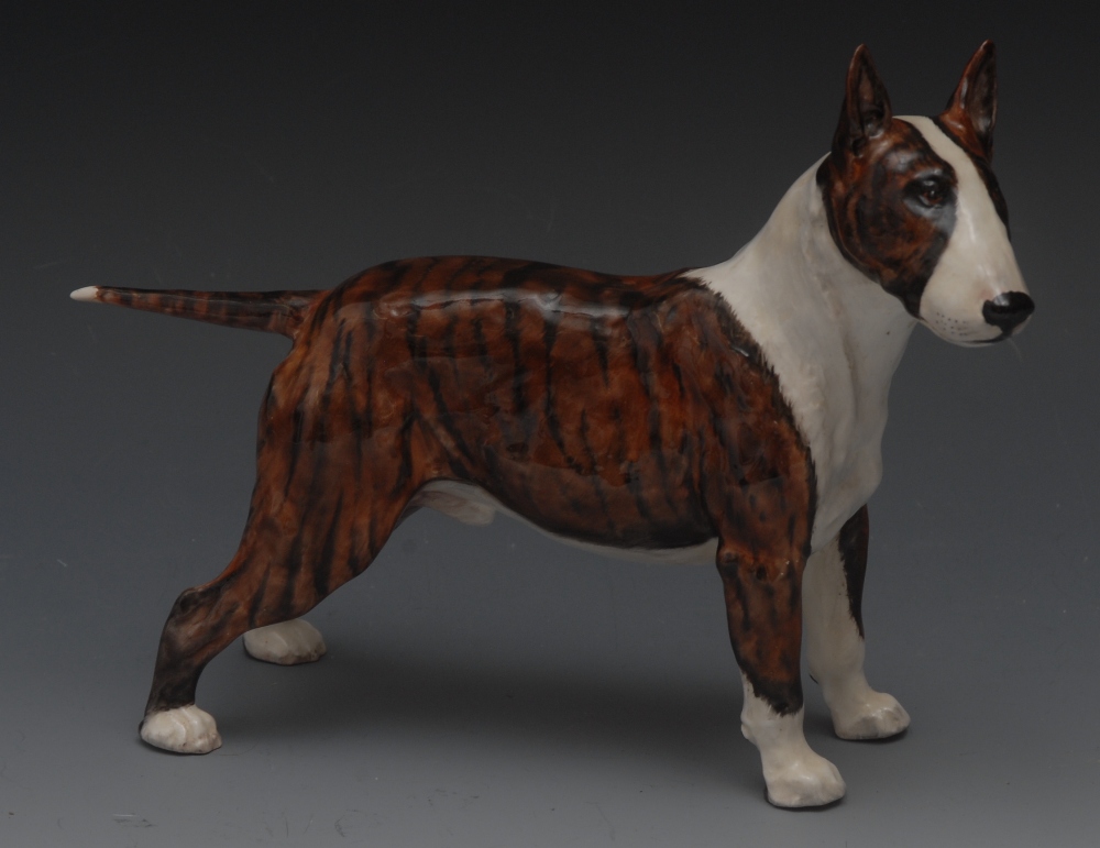 A Royal Doulton dog, designed by Frederi