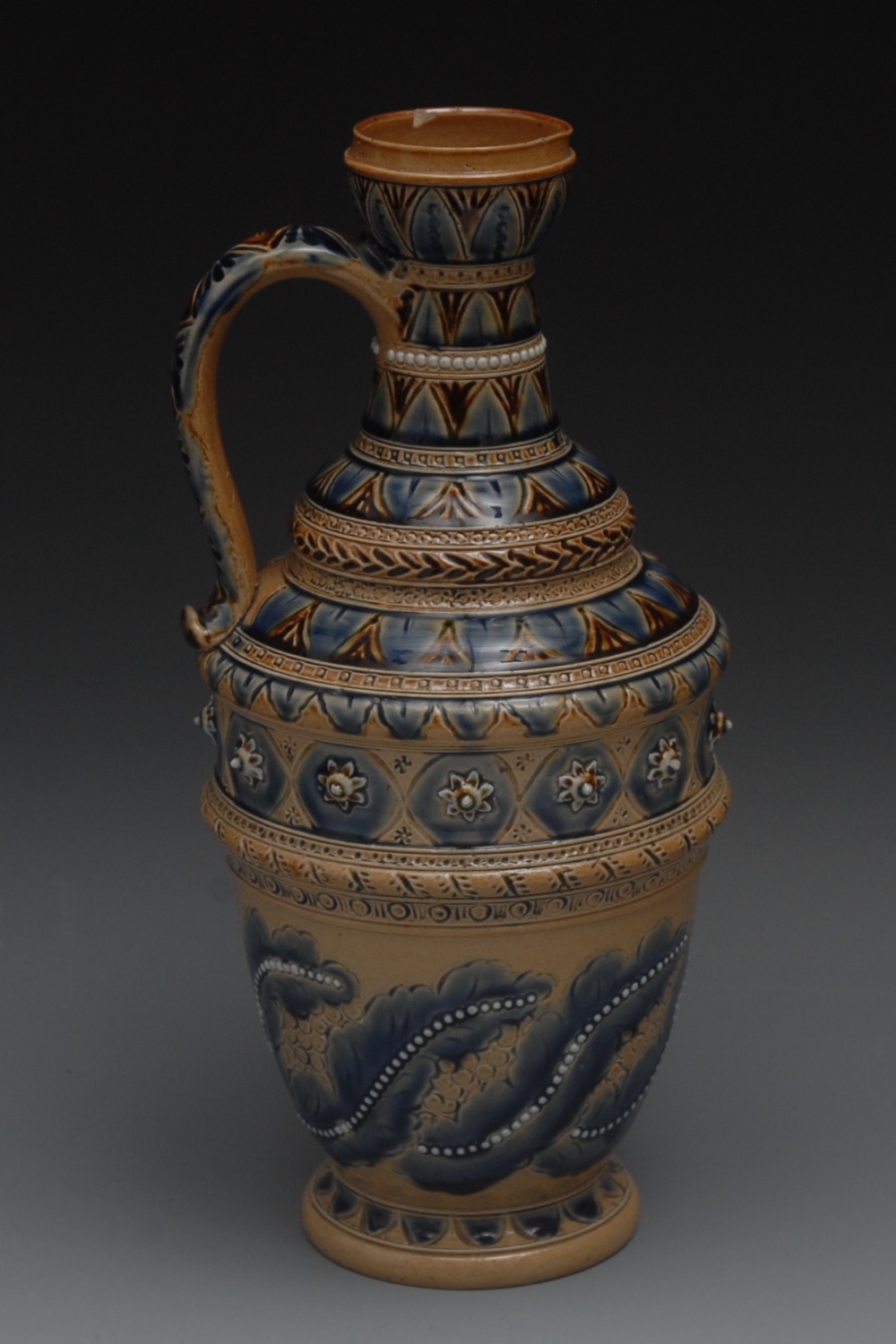 A Doulton Lambeth ewer, incised with lea