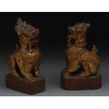 A pair of Chinese carved and lacquered t