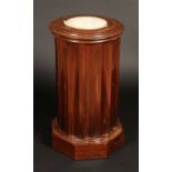 A Victorian mahogany fluted cylindrical pot cupboard, the ring turned top with white marble panel,