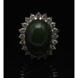 A Nephrite and diamond cluster ring, cen