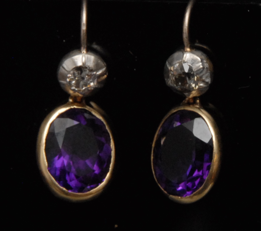 A pair of amethyst and diamond drop earr