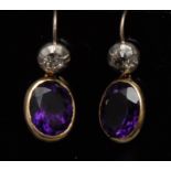 A pair of amethyst and diamond drop earr