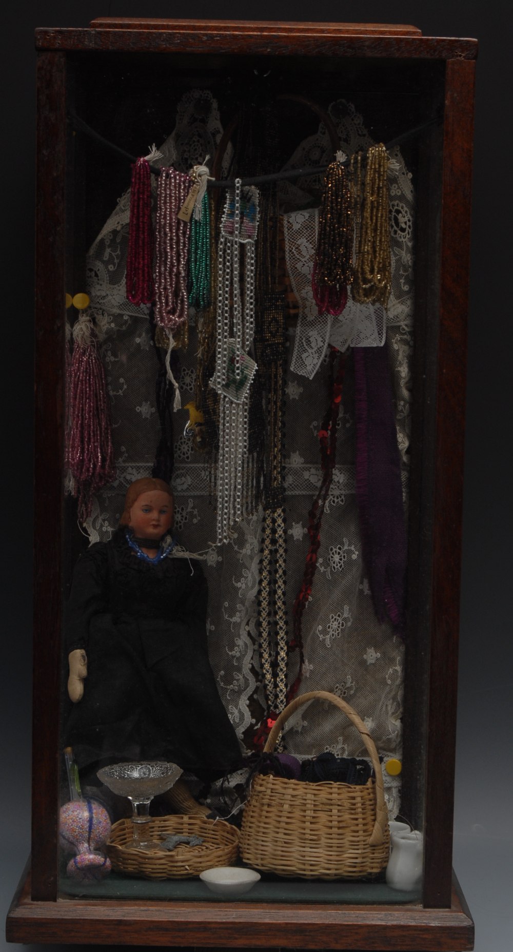 A novelty diorama of a rag and bone lady