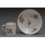 A Sevres coffee can and saucer, painted