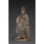 A Japanese ivory okimono of a geisha, sh