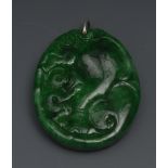 A Burmese emerald green jade pedant, car