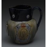 A Royal Doulton Coronation ovoid jug, in relief with portrait cartouches of King George V and