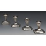 A set of four George V boudoir candlesti