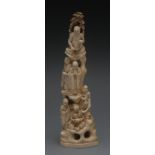 A Chinese ivory tusk section, carved in