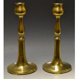 A pair of William Tonks brass candlestic