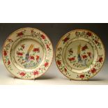 A pair of Chinese Famille Rose plates, colourfully decorated in polychrome with a Lady Amhurst