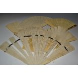 A Victorian ivory fan, the crested toppe