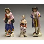 A pair of Continental miniature figures,