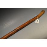 A Japanese bamboo walking cane, carved w